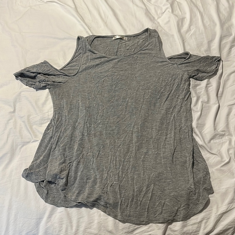Gray partially off shoulder shirt